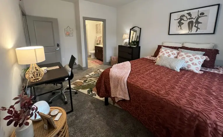 furnished apartment bedroom with study desk